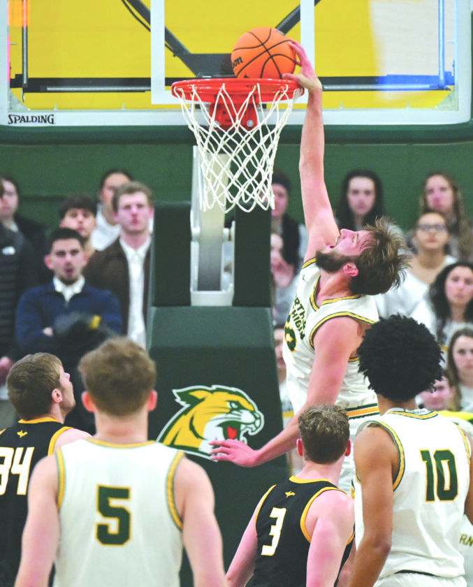 Wildcat men ride raucous wave to win over U.P. rival Huskies